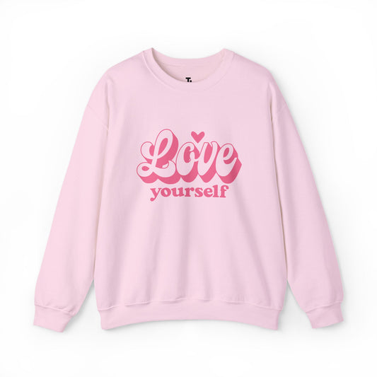 Pink sweatshirt with 'Love yourself' text on a white background