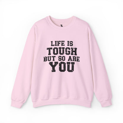 Pink sweatshirt with 'Life is tough but so are you' text on a white background