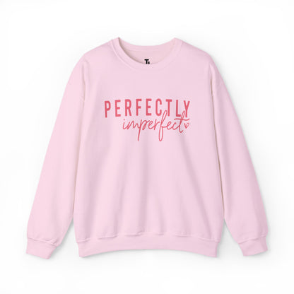 Pink sweatshirt with 'Perfectly Imperfect' text on a white background